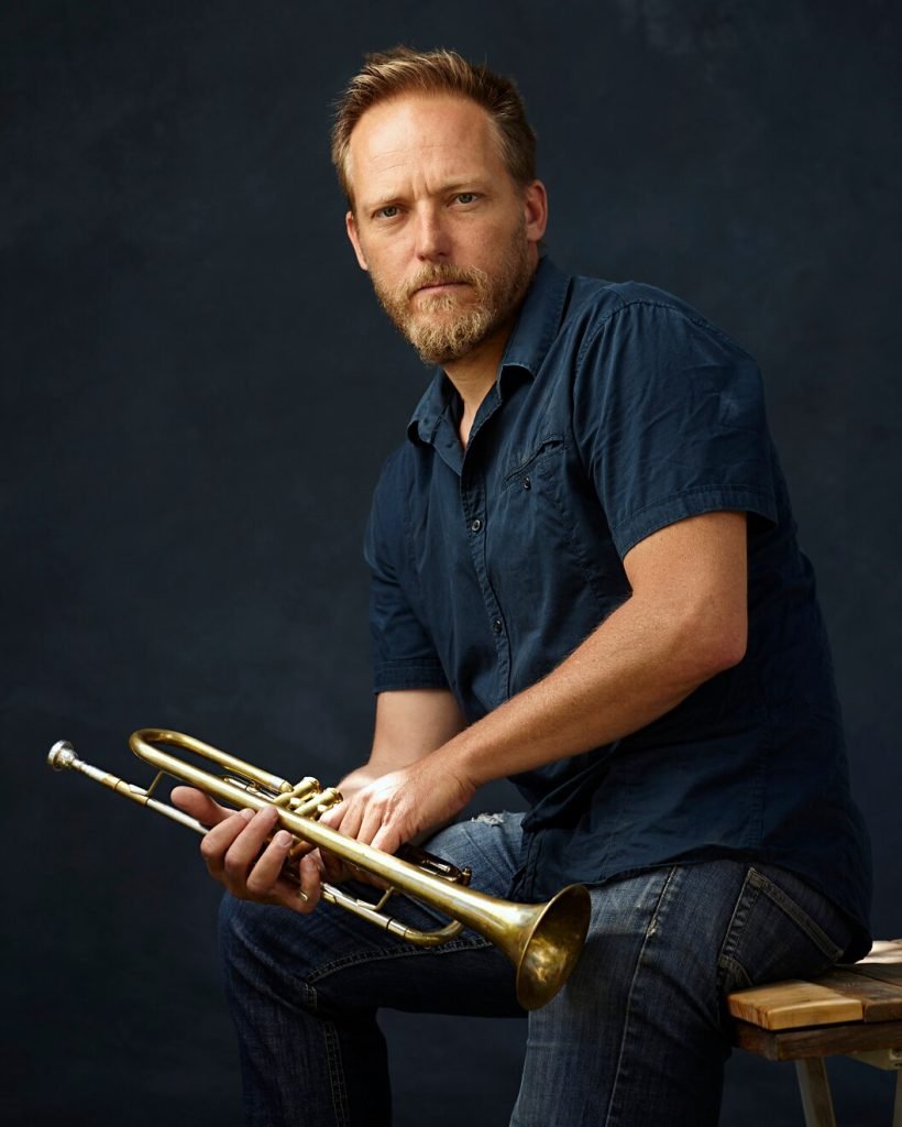musician-posing-with-his-instrument_150588-13
